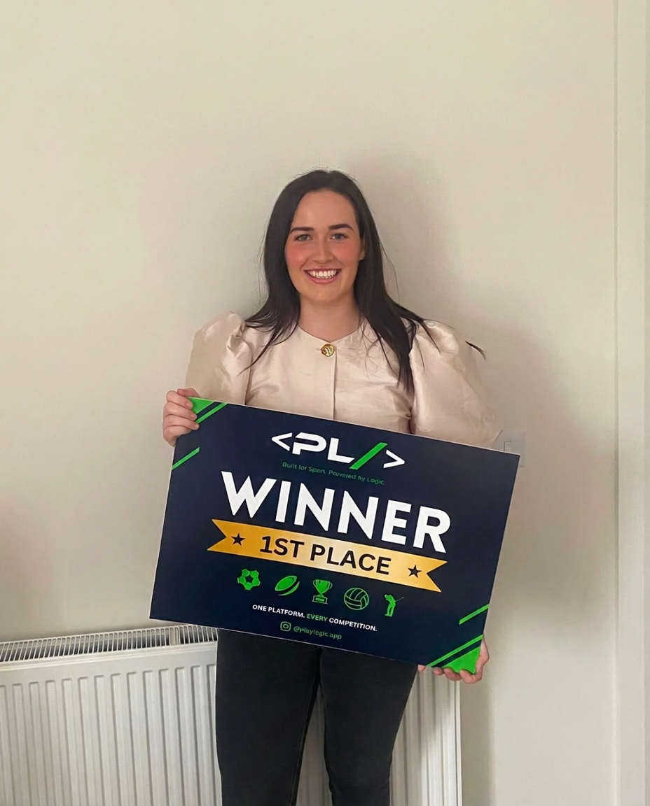 PlayLogic winner of the PlayLogic World Cup 2026 Predictor holding the PlayLogic winner board